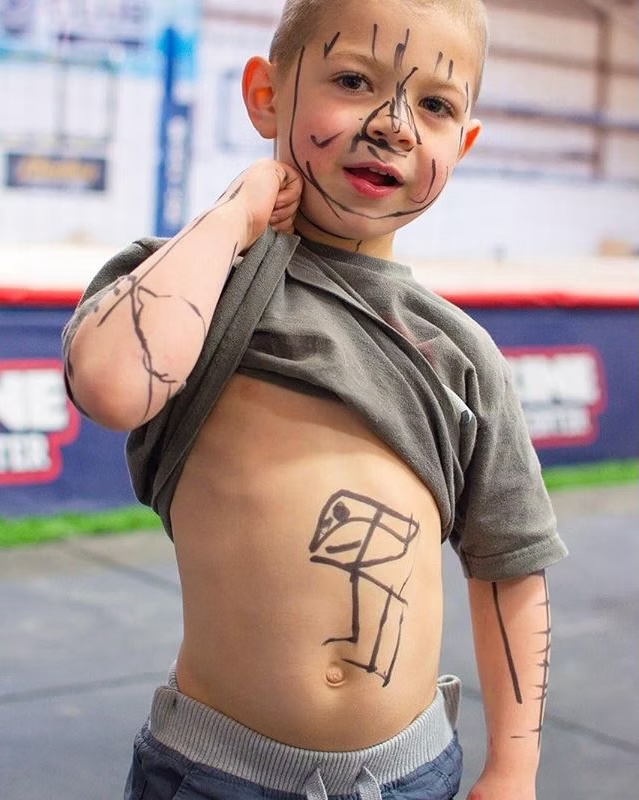 Child drawing on himself